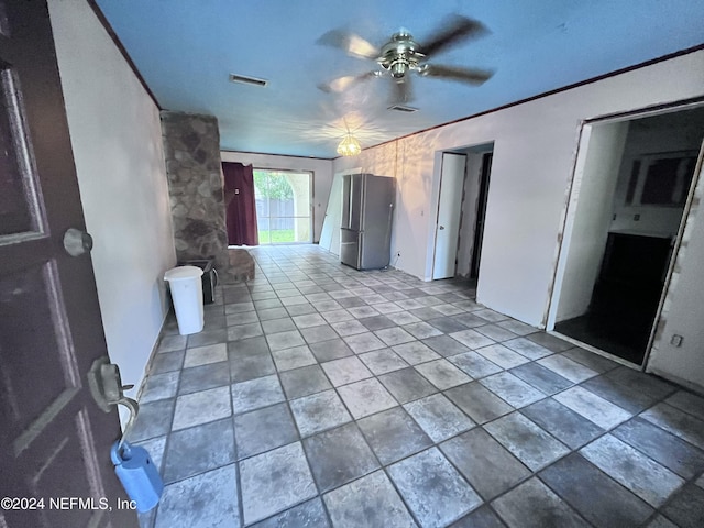 interior space with ceiling fan