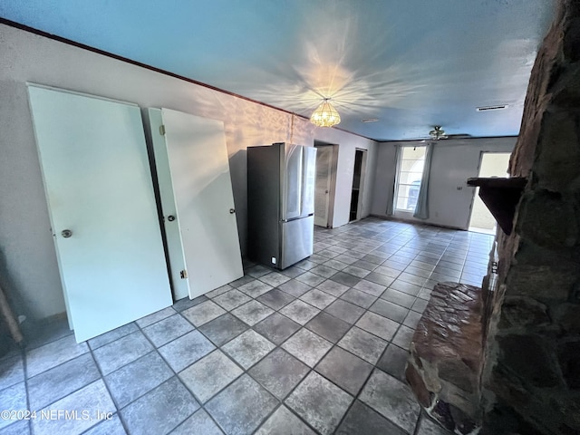 unfurnished living room featuring an inviting chandelier