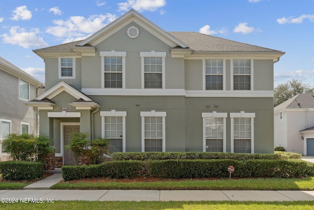 townhome / multi-family property featuring stucco siding