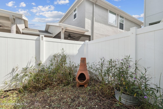 view of yard with ceiling fan