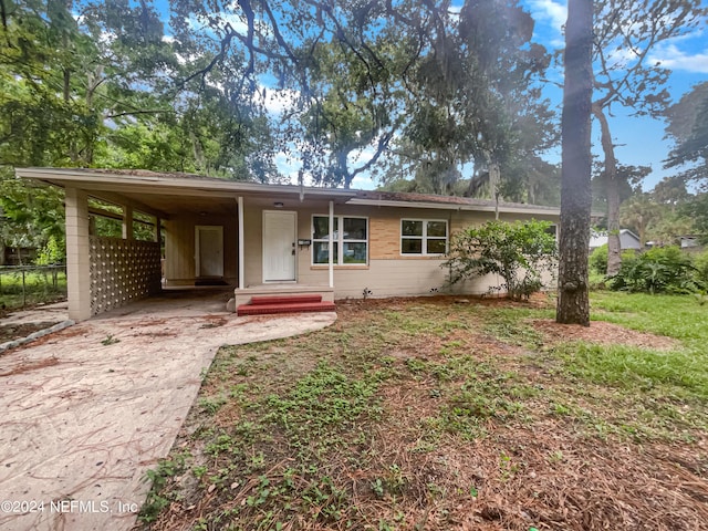 view of front of home featuring a carport