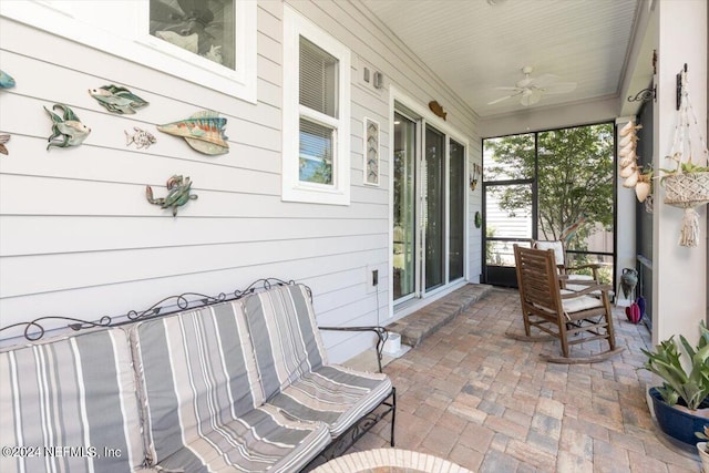 sunroom / solarium with ceiling fan