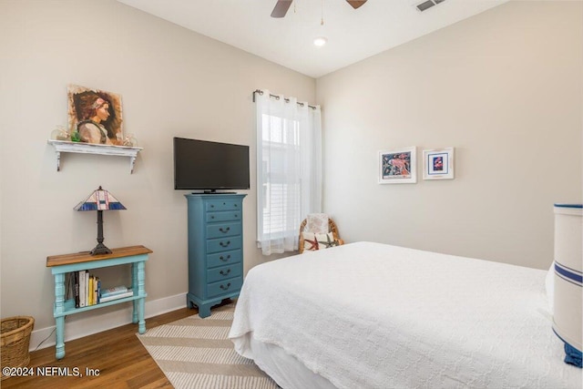 bedroom featuring hardwood / wood-style flooring and ceiling fan