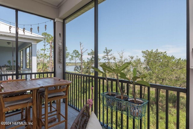 sunroom with a water view