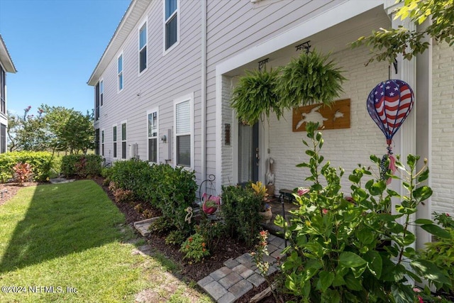 view of property exterior with a lawn