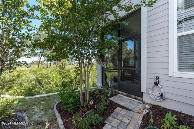 view of yard with a sunroom