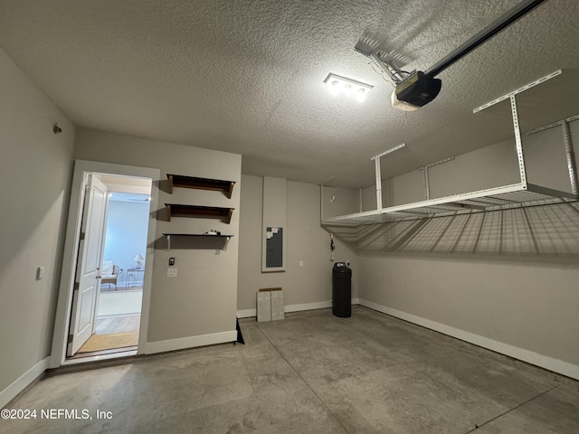 garage featuring a garage door opener and electric panel