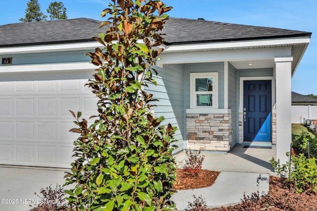 view of exterior entry featuring a garage