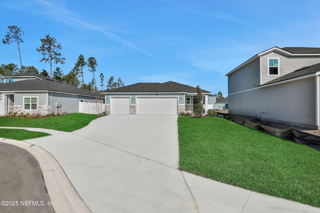 view of front of property featuring a garage and a front lawn