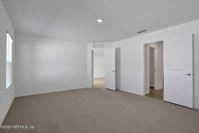 unfurnished bedroom featuring carpet flooring