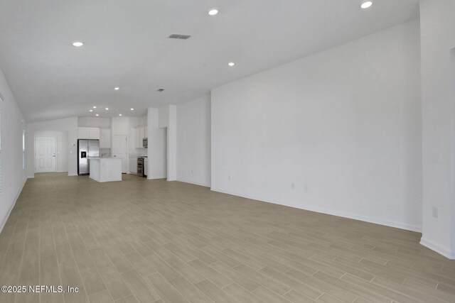 unfurnished living room featuring light wood-type flooring