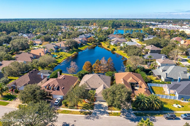 birds eye view of property with a water view