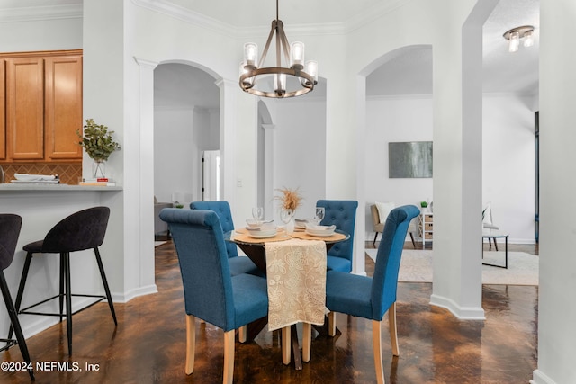 dining room featuring crown molding and an inviting chandelier