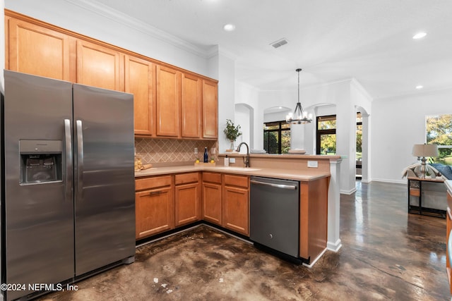 kitchen with tasteful backsplash, a notable chandelier, crown molding, pendant lighting, and appliances with stainless steel finishes