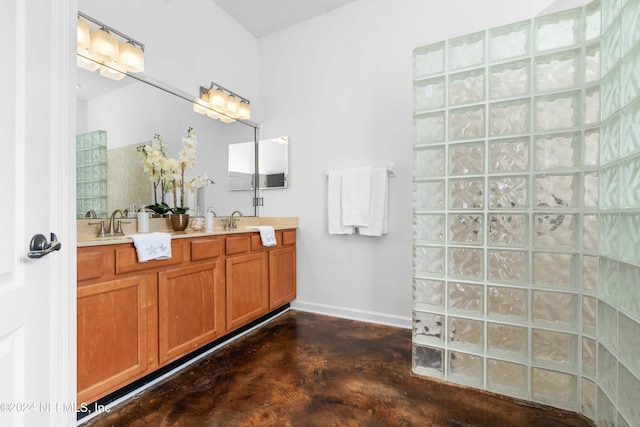 bathroom with vanity and concrete floors