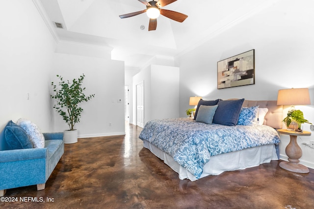 bedroom with a raised ceiling, ceiling fan, and ornamental molding