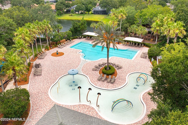 view of swimming pool with a water view