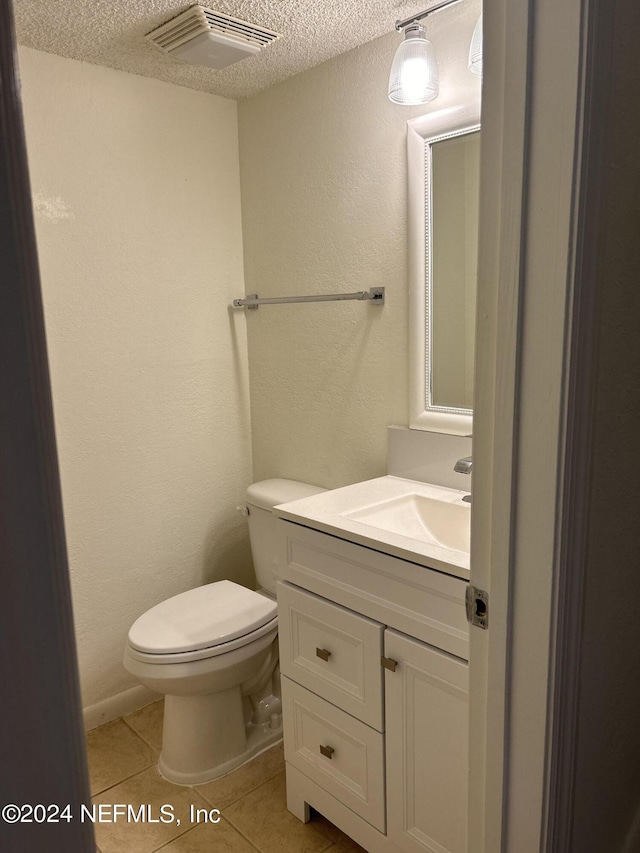 100 Fairway Park Blvd Unit 605, Ponte Vedra Beach, FL 32082 - bathroom with a textured ceiling, tile patterned floors, vanity, and toilet