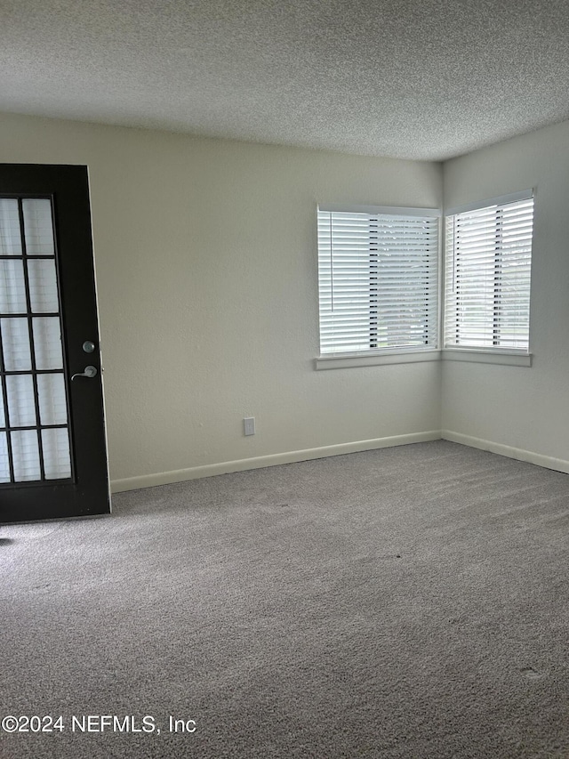 100 Fairway Park Blvd Unit 605, Ponte Vedra Beach, FL 32082 - carpeted spare room with a textured ceiling, healthy amount of natural light, and baseboards
