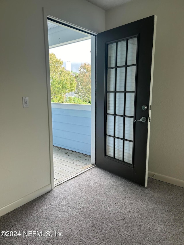 entryway with carpet