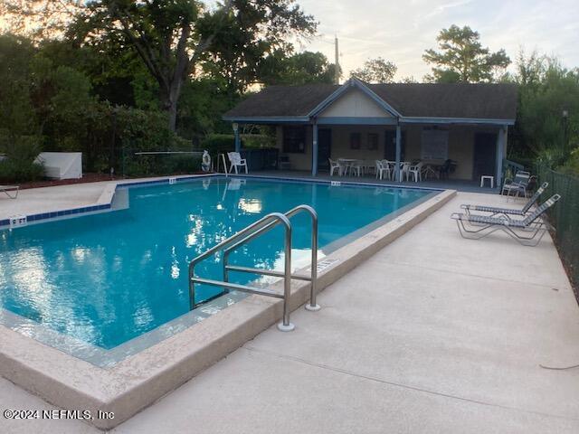 view of swimming pool featuring a patio area