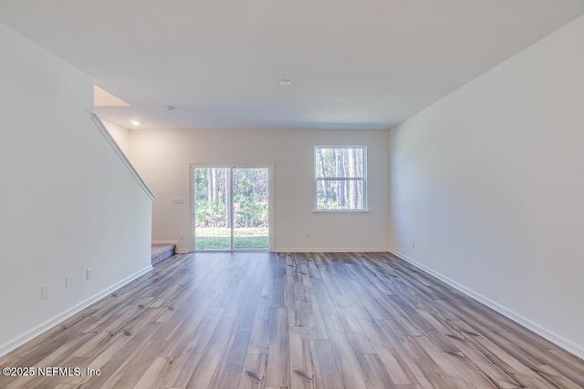 unfurnished room featuring light hardwood / wood-style floors