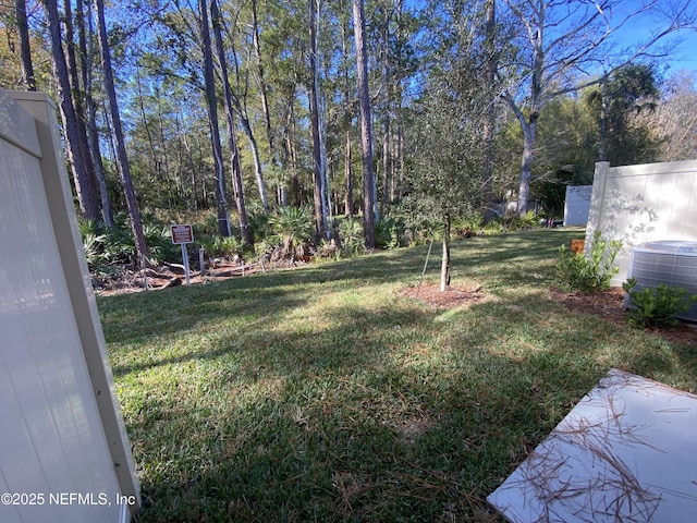 view of yard with central AC unit