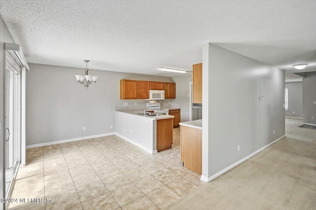 kitchen featuring light tile patterned flooring, a chandelier, kitchen peninsula, pendant lighting, and white appliances