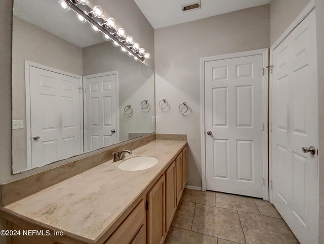 bathroom featuring vanity and tile patterned flooring