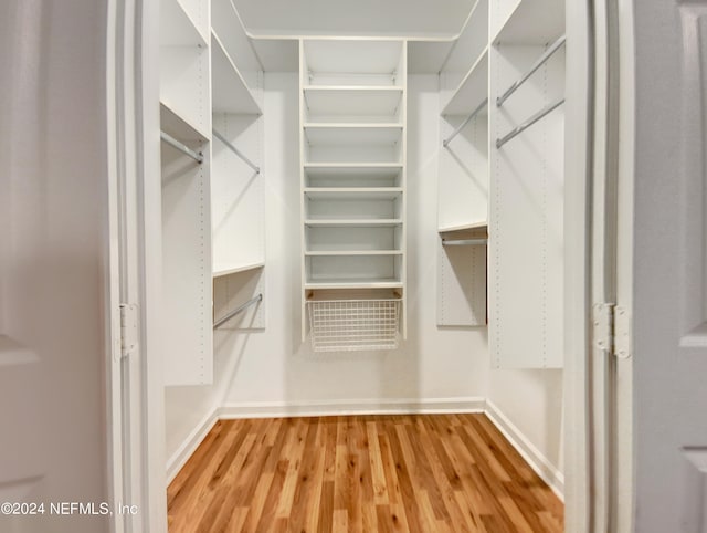 walk in closet featuring hardwood / wood-style floors