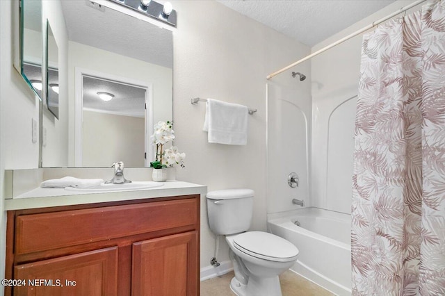 full bathroom featuring vanity, shower / bath combination with curtain, toilet, and a textured ceiling