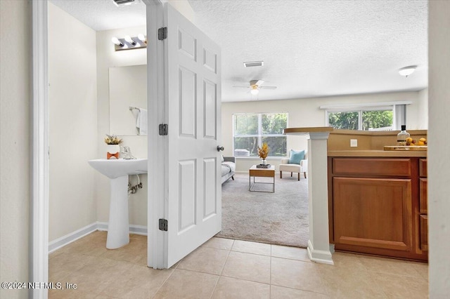 bathroom with tile patterned flooring and ceiling fan