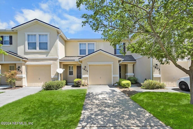 view of front of home with a garage and a front yard