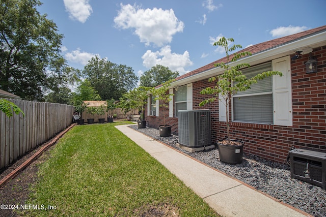 view of yard with central AC