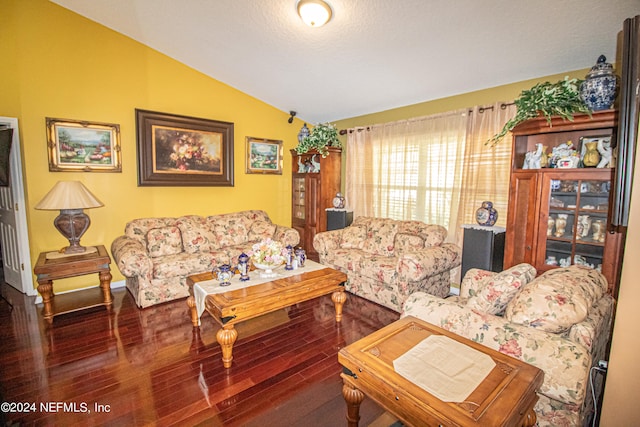 living room with hardwood / wood-style floors and vaulted ceiling