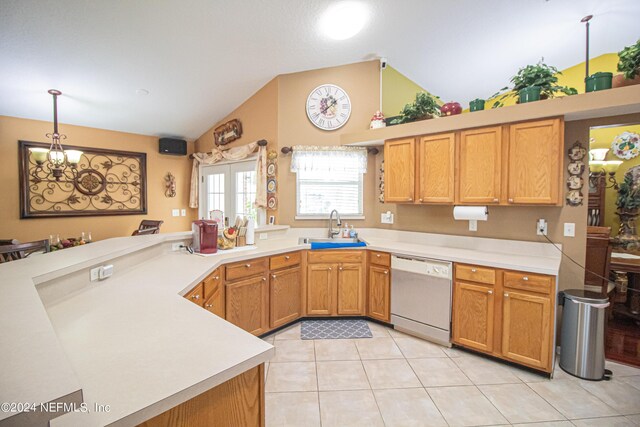 kitchen featuring pendant lighting, sink, kitchen peninsula, white dishwasher, and light tile patterned floors