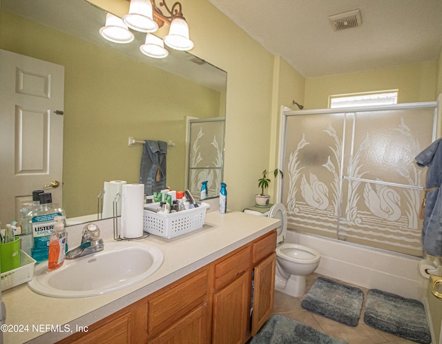 full bathroom featuring shower / tub combination, tile patterned flooring, vanity, toilet, and a notable chandelier