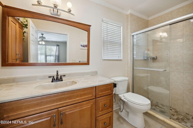 bathroom with ornamental molding, vanity, walk in shower, toilet, and tile patterned floors