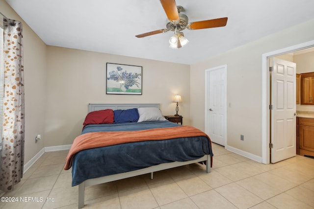 bedroom featuring ceiling fan, baseboards, and light tile patterned floors