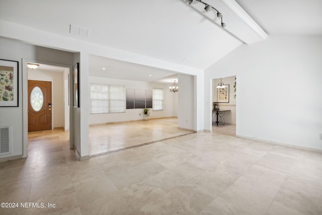 unfurnished living room featuring a chandelier and lofted ceiling with beams