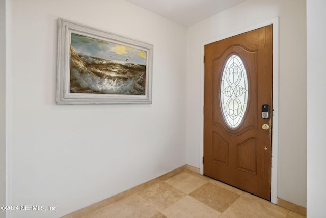 entryway featuring baseboards