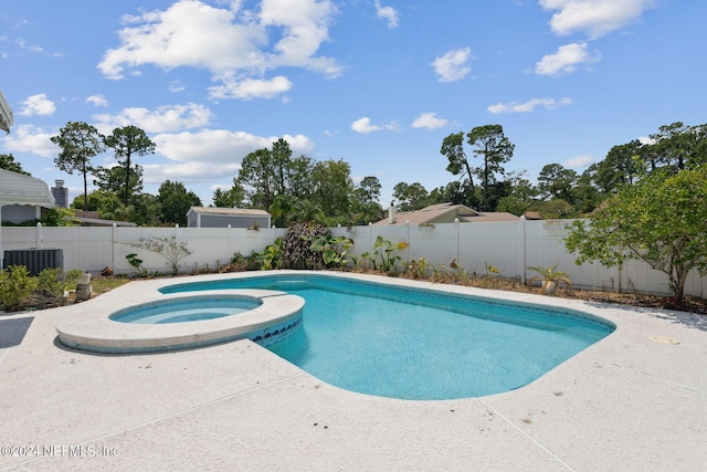 view of pool featuring an in ground hot tub