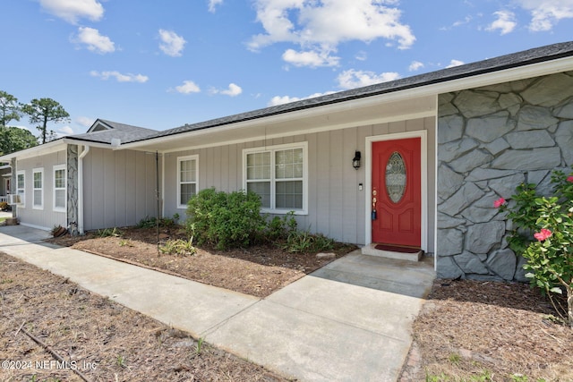 view of front of home with stone siding