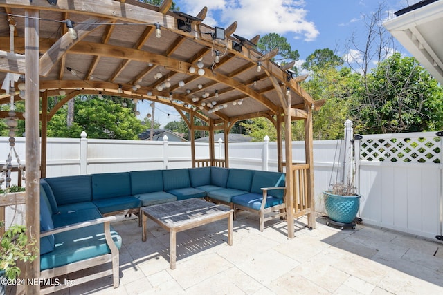 view of patio / terrace with an outdoor living space and a pergola