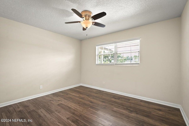 unfurnished room with ceiling fan, dark hardwood / wood-style floors, and a textured ceiling