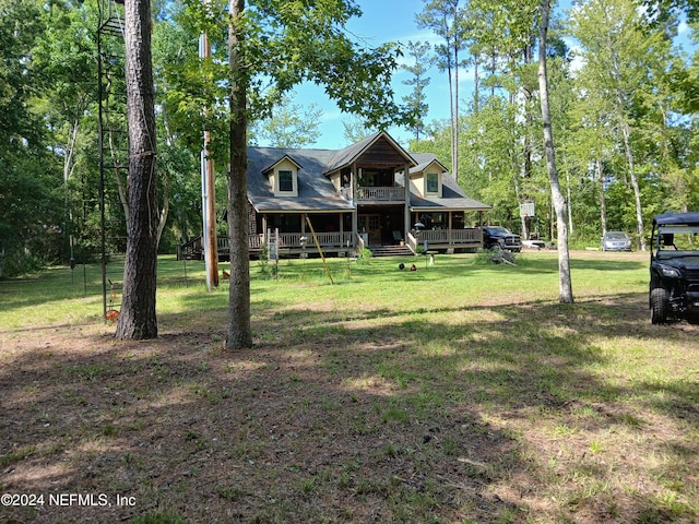 view of front facade with a front yard and a porch