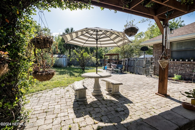 view of patio / terrace featuring a storage unit