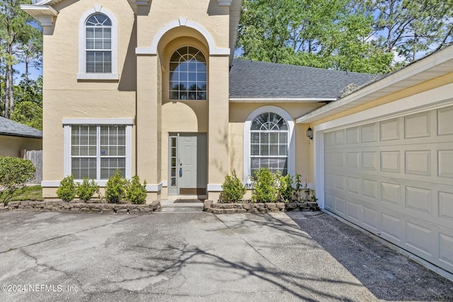 property entrance with a garage