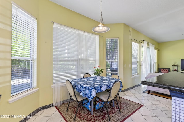 dining space featuring light tile patterned floors