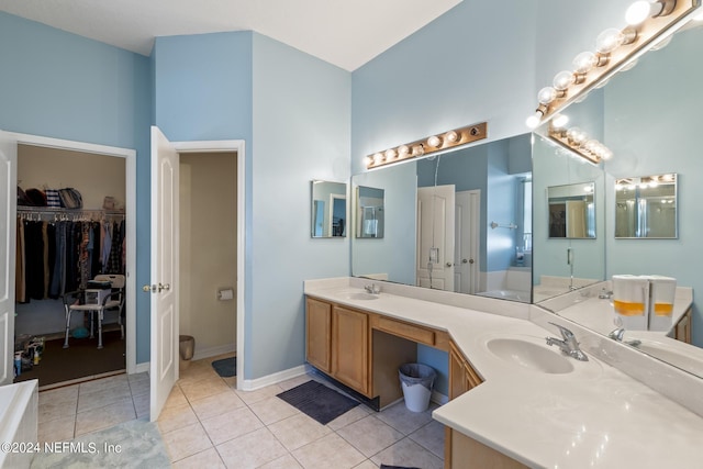 bathroom with tile patterned floors and vanity